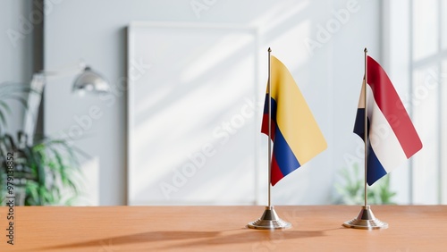 FLAGS OF COLOMBIA AND NETHERLANDS ON TABLE