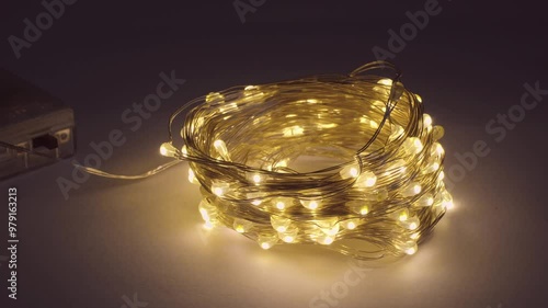 warm White Christmas garland lies on the floor. . New Year's lamps, decoration for the holiday. background saver.