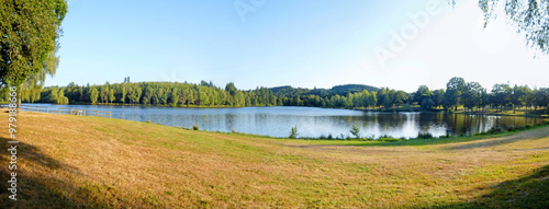 The Ponty pond, near Ussel in Aveyron, is located at the foot of the Millevaches plateau, popular for fishing and walking, it is surrounded by forests and is home to ducks, moorhens and water lilies photo