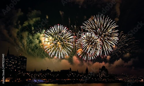 Fireworks over the city, Explosive fireworks light up the night sky over a city, creating a colorful display of lights and shapes.