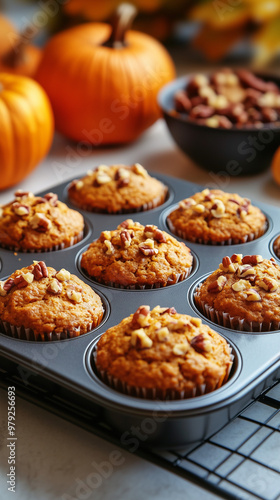 Freshly Baked Pumpkin Muffins on a Cooling Rack in a Bright Kitchen