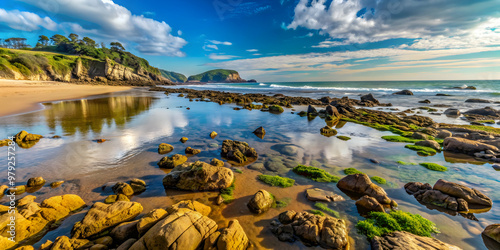 Low tide revealing the rocky shoreline of Sopela beach , Low tide, rocky beach, Sopela, coastline, seascape photo