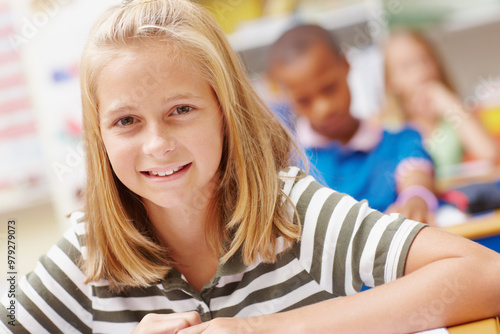 Smile, portrait and girl in classroom for learning, growth and child development at elementary school. Happy, face and student at desk for education, study and future opportunity for scholarship.