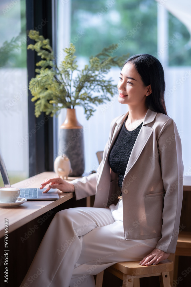 asian freelance people business female talking making using casual working with laptop computer for browsing internet, chatting and blogging and smartphone,notebook in coffee shop.