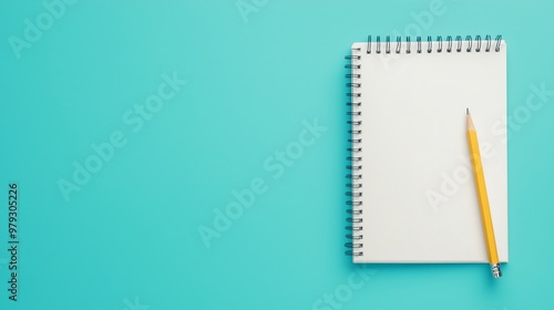 A blank notepad and a yellow pencil on a vibrant turquoise background, perfect for creative ideas and note-taking.