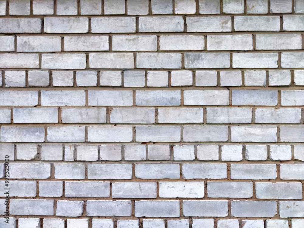 A textured white brick wall creates a versatile background with patterns and areas suitable for adding text or graphics A textured white brick wall creates a versatile background with patterns and areas suitable for adding text or graphics