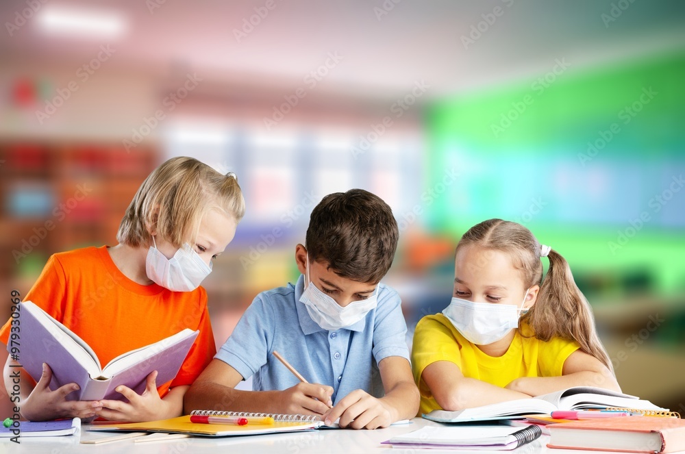 School children students sit at desks, studying School children students sit at desks, studying