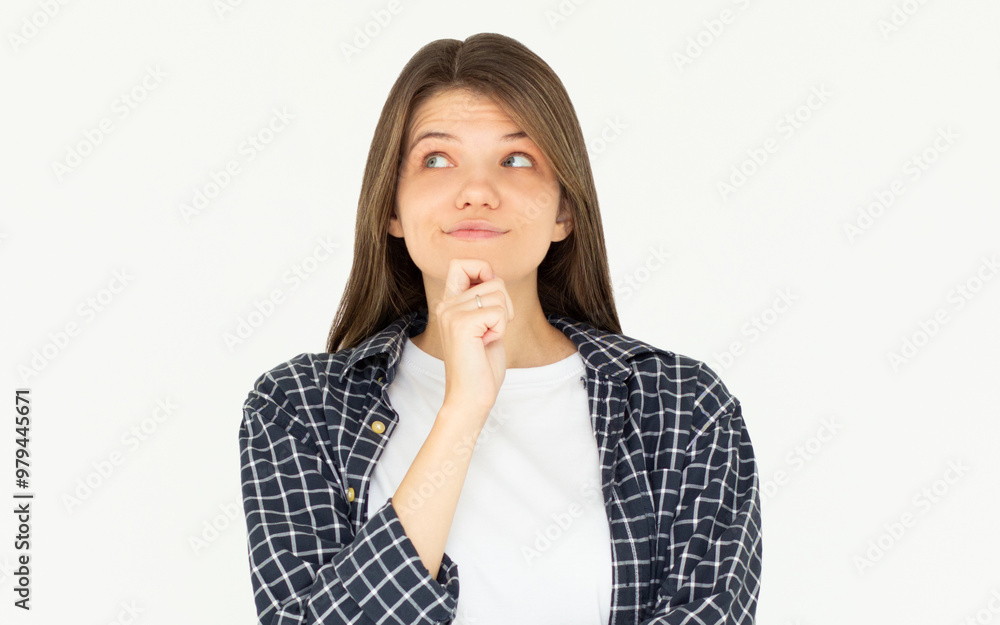 Cute woman thinking about smth. Young brunette student girl is thoughtful on white background Cute woman thinking about smth. Young brunette student girl is thoughtful on white background
