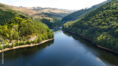 Aerial drone footage of a Oasa Lake from Sureanu mountains, Alba county, Transalpina, Transylvania, Romania. Romanian wild nature and landscape from above. 4K drone footage