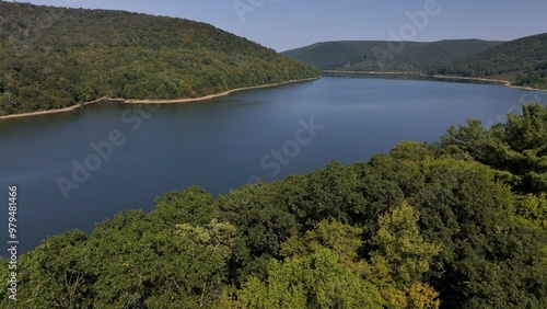 Peaceful calm water beautiful lake reservoir in mountain wilderness in Allegheny Forest in Pennsylvania for camping and hiking in nature 