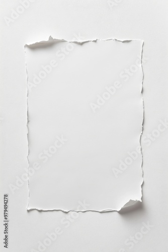 Torn edge blank paper sheet on a clean surface, ideal for notes, messages, or creative projects.