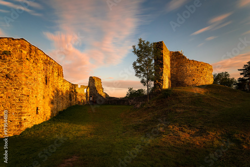 Perimeter walls of the collapsed Borotín castle in the Tábor district in southern Bohemia at sunrise. Photographed by long exposure technique photo