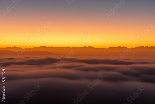 Wallpaper Mural View of Cape Town city shrouded in fog during a serene morning, Signal Hill, South Africa. Torontodigital.ca