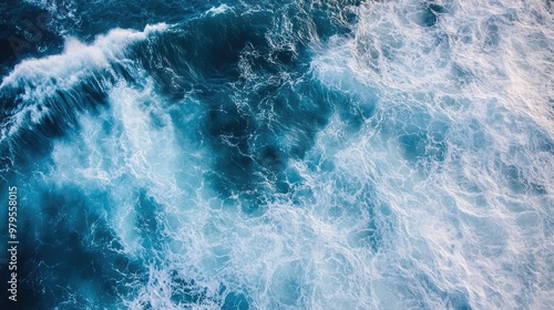 Aerial view of large ocean swells forming patterns as they approach the shore.