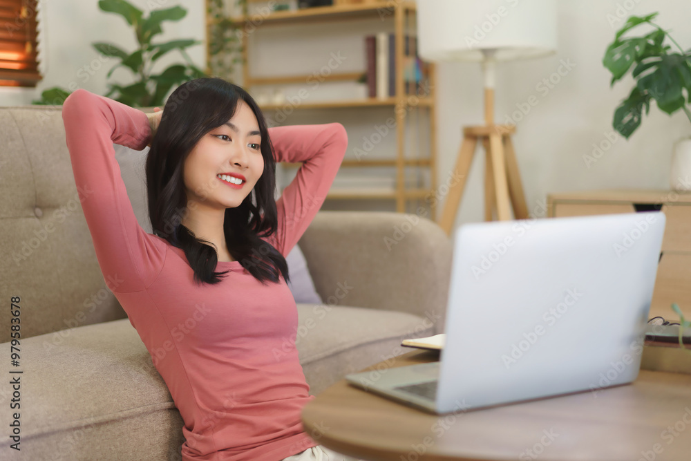 Young businesswoman sitting on the floor to relaxation and watching movie on laptop with happiness Young businesswoman sitting on the floor to relaxation and watching movie on laptop with happiness