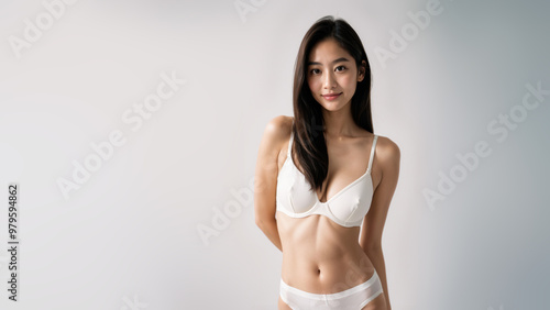 shot of an Asian girl white camisole pajamas bikini, highlighting her bright eyes and genuine smile against the clean white background.