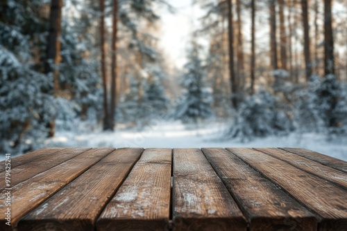 Wooden table in snowy forest with trees in background. photo