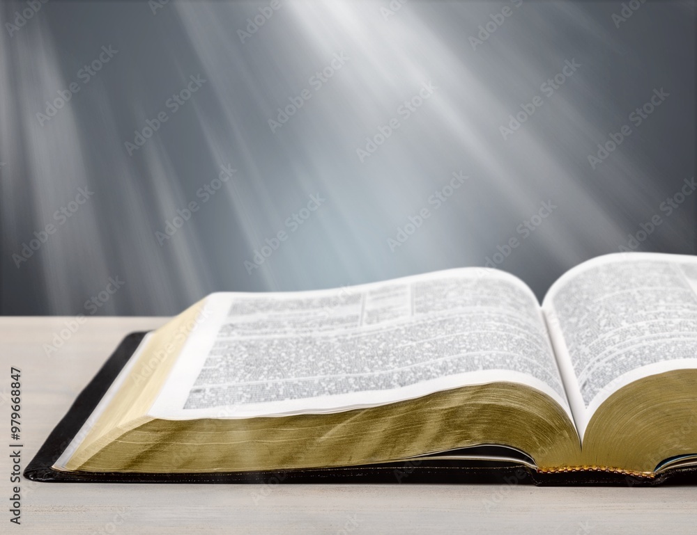 Fototapeta premium Open Bible book on the wooden table