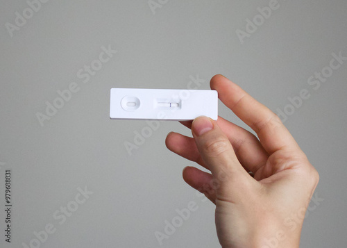 Negative result of antigen covid test in the hands which means that the person is not infected with the virus and doesn't need treatment