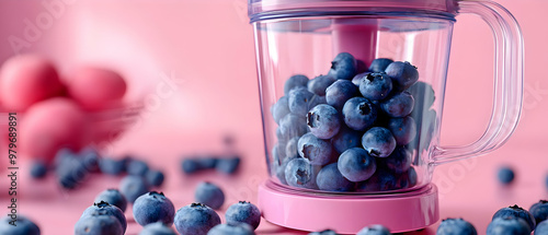 A vibrant pink blender filled with fresh blueberries, surrounded by more berries and eggs on a pastel pink background. photo