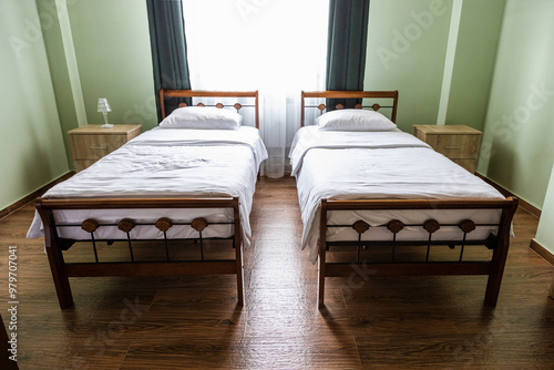 Konstfotografi two beds in room in local hotel