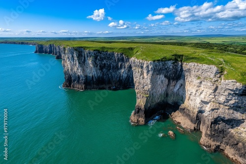 British Isles coastline featuring the towering cliffs of Fair Head in Northern Ireland, jutting out into the North Channel photo