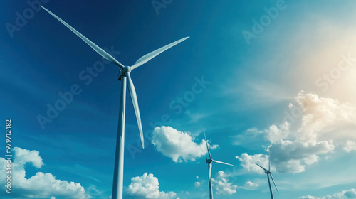 A wind farm with turbines spinning under a clear blue sky, generating clean, renewable energy