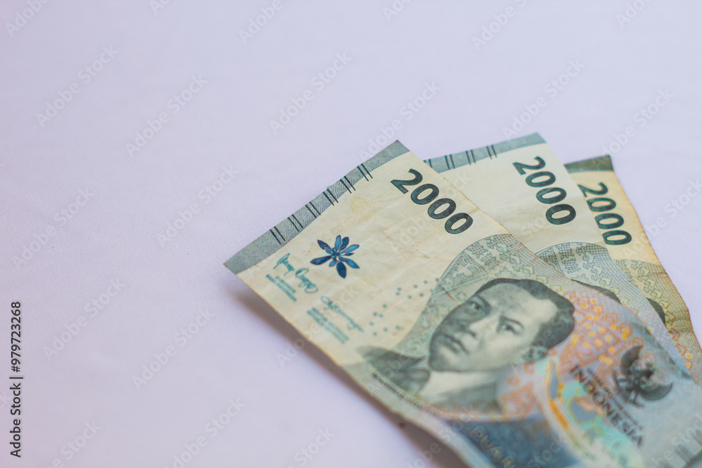 Indonesia October 13, 2024 6000 rupiah note in close up photo from top corner Indonesia October 13, 2024 6000 rupiah note in close up photo from top corner
