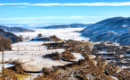 Clouds in the form of fog spread through the gorges in the Caucasus Mountains