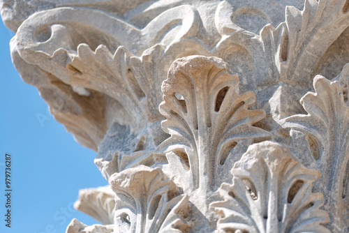 Close-up of ancient greek column showing acanthus leaves decoration. Kourion archaeological site, Cyprus photo