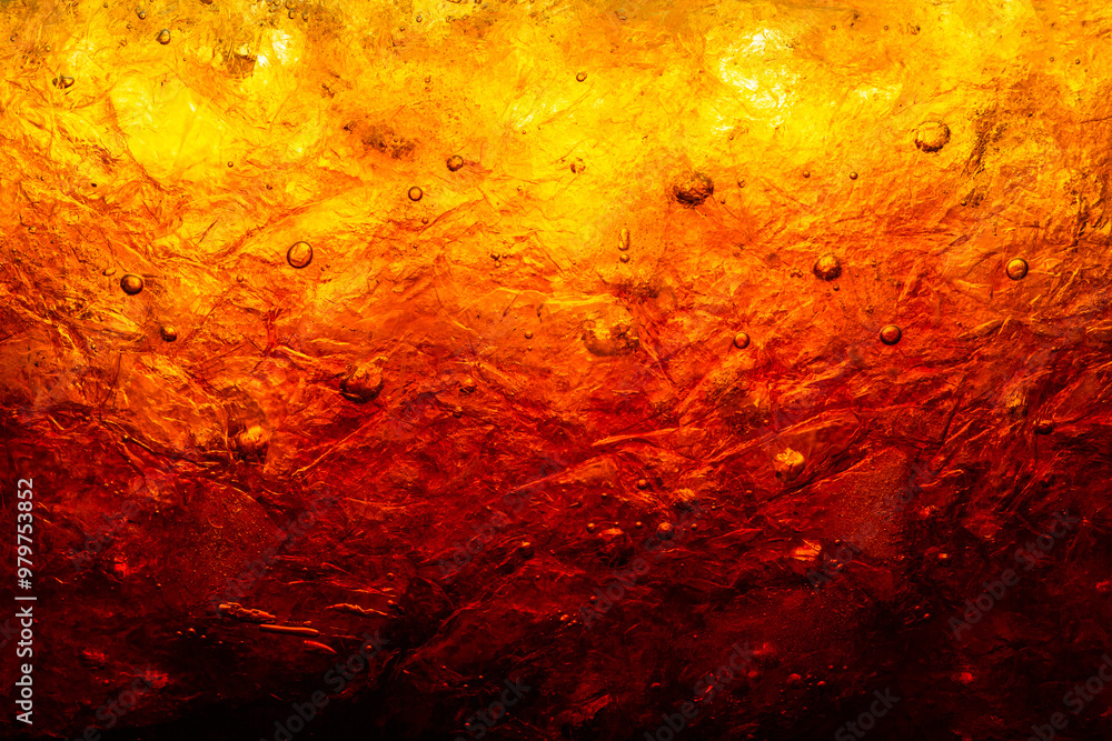 Close-up of cola drink and ice,Background of cola with ice and bubbles,macro cola background,Background of cola with ice and bubbles. Side view background of refreshing cola flavored soda with carbona Close-up of cola drink and ice,Background of cola with ice and bubbles,macro cola background,Background of cola with ice and bubbles. Side view background of refreshing cola flavored soda with carbona