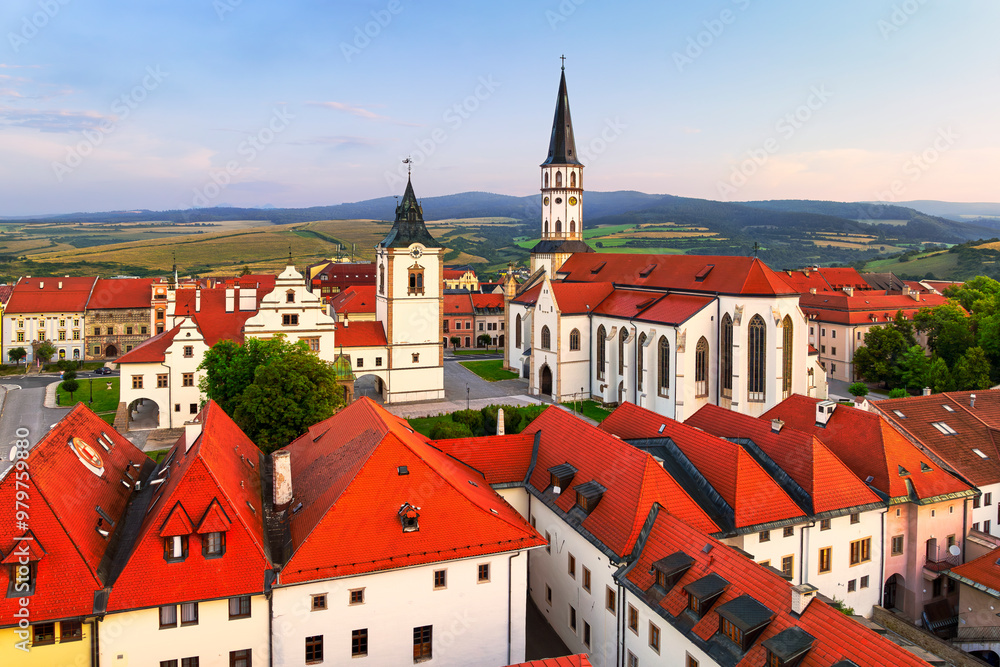 Fototapeta premium Aerial view of the historical center of Levoca (Slovakia) with two important monuments - the Basilica of St. James and the city hall