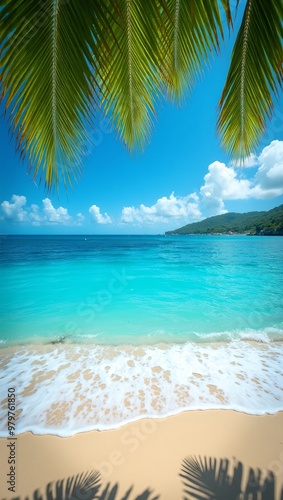 Tropical beach with blue waters waves and lush palm leaves