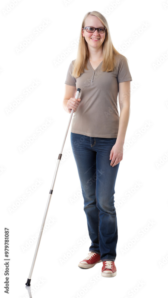 Woman confidently walking with a white cane, symbolizing mobility aid and independence.