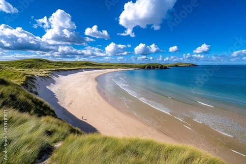 British Isles coastline at Whitepark Bay, with wide sandy beaches and grassy dunes on Northern Irelandâ€™s coast photo