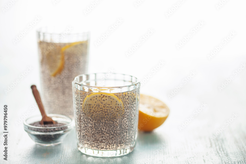 Chia seed water in drinking gasses on wooden table. Drink for a healthy diet Chia seed water in drinking gasses on wooden table. Drink for a healthy diet