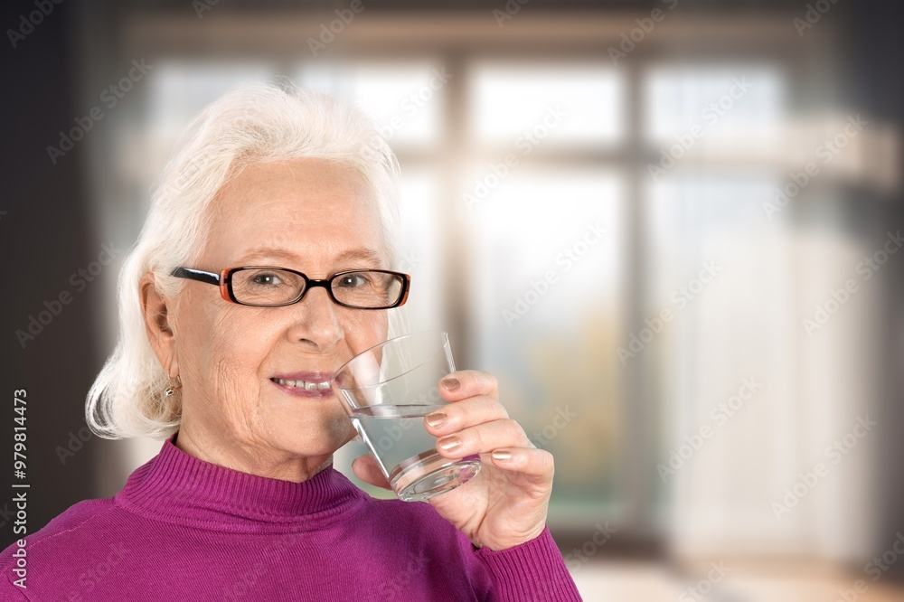 Photo of pretty old woman in living room indoor Photo of pretty old woman in living room indoor
