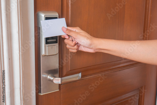 open smart door using card. female hand open the door.