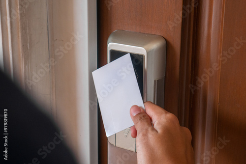open smart door using card. female hand open the door.