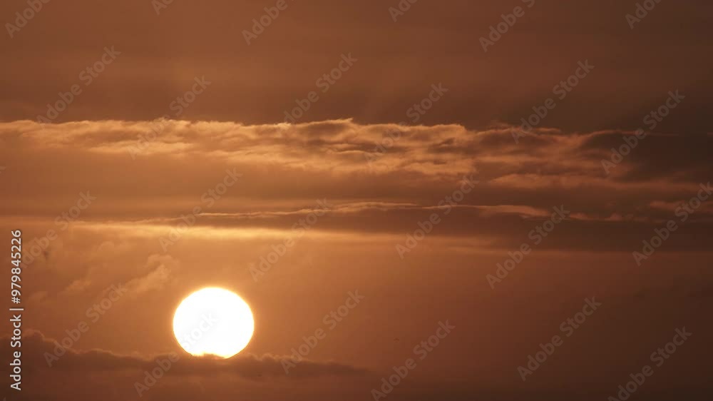 Time lapse cloudscape with sun rising up from morning to day on a warm lit sky. Time lapse cloudscape with sun rising up from morning to day on a warm lit sky.