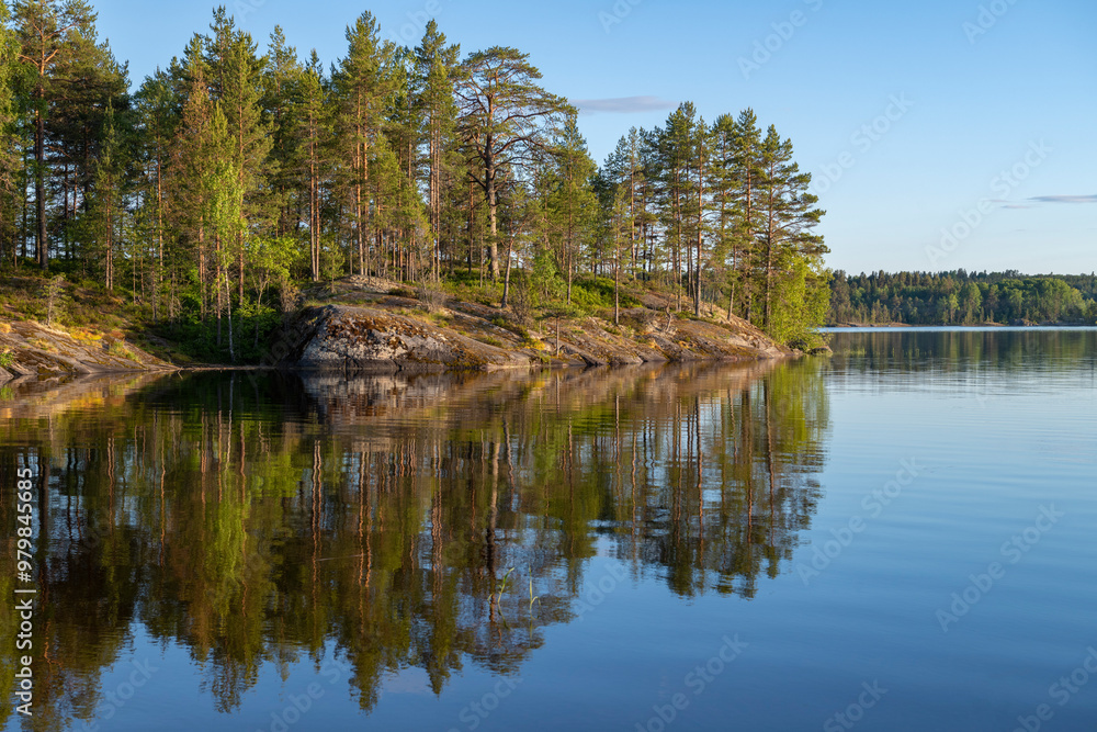 June sunny evening at the Koyonsaari island. Karelia, Russia June sunny evening at the Koyonsaari island. Karelia, Russia
