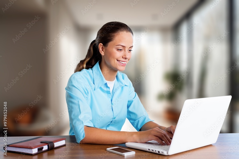 Happy smiling young woman work on laptop Happy smiling young woman work on laptop