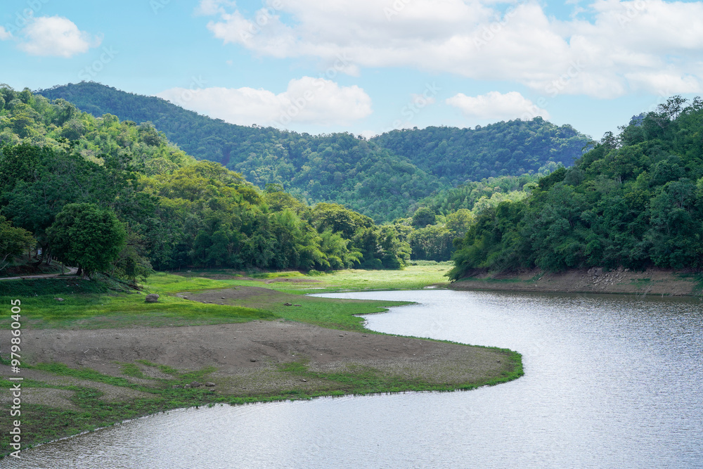Lake landscape and mountain view and clouds with sunlight on blue sky at Huai Pradu Forest Ranger Unit, Lopburi, Thailand. Lake landscape and mountain view and clouds with sunlight on blue sky at Huai Pradu Forest Ranger Unit, Lopburi, Thailand.