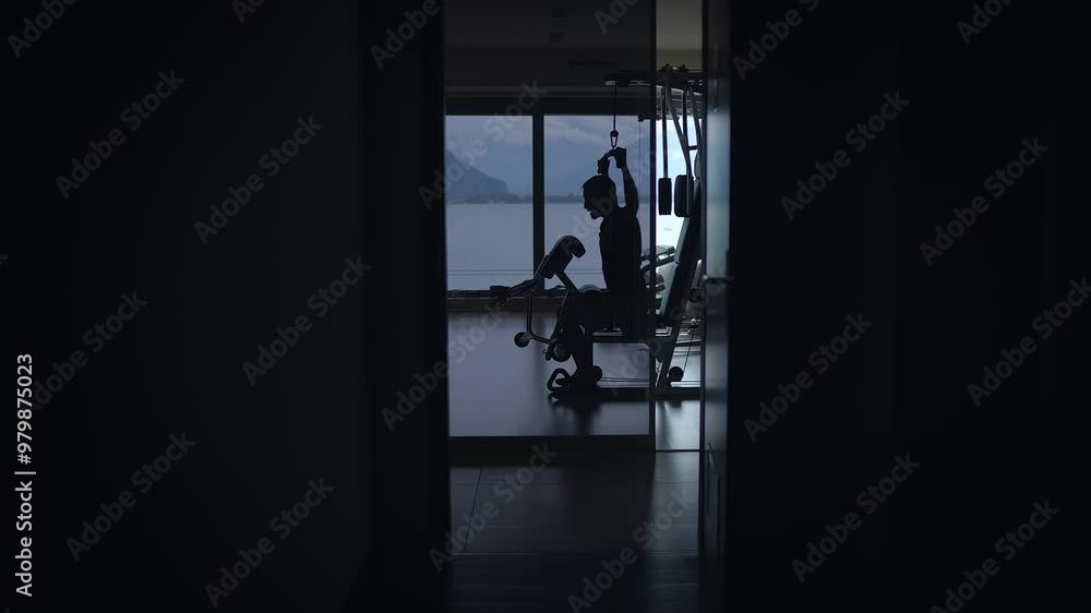 The silhouette of fitness is beautifully presented in a stylish and modern indoor gym The silhouette of fitness is beautifully presented in a stylish and modern indoor gym
