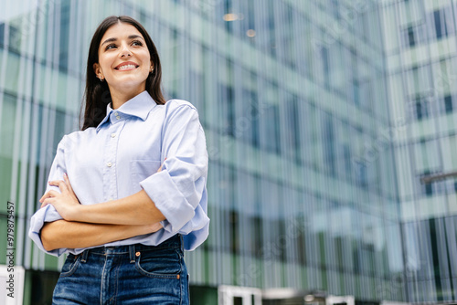 Fotografie Successful professional boss businesswoman standing over corporate office building