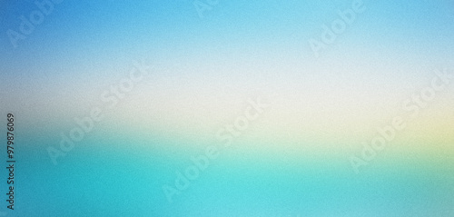 Abstract blurred background fading from blue to yellow with grainy texture