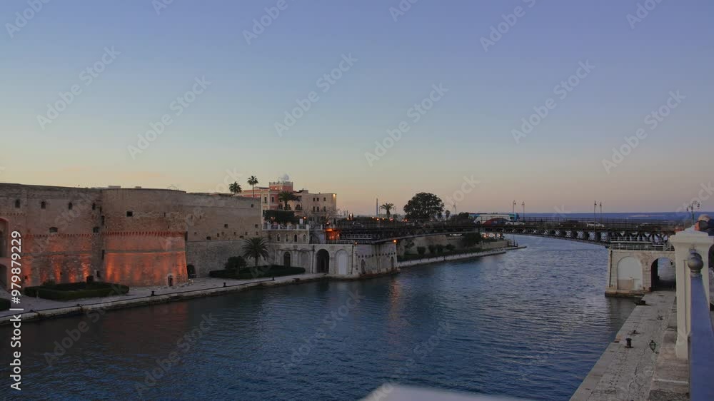 Aragonese castle of Taranto at sunset with orange colors in high definition Aragonese castle of Taranto at sunset with orange colors in high definition