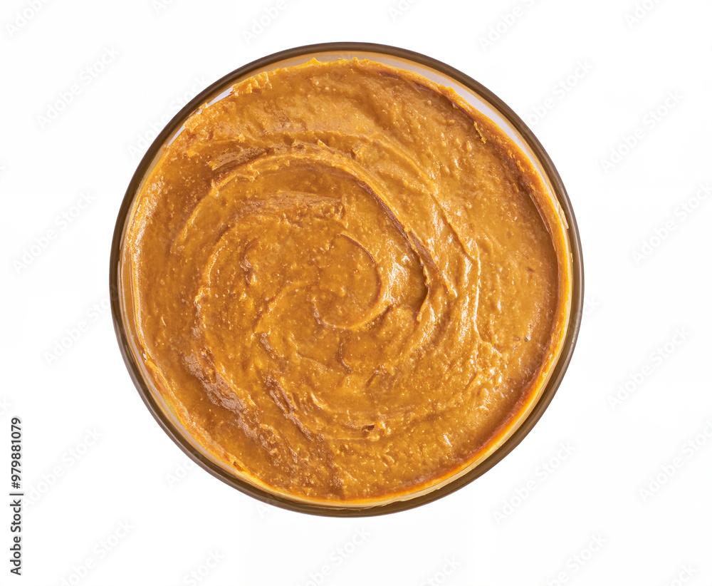 Overhead View of a Bowl of Smooth Peanut Butter on a White Background Overhead View of a Bowl of Smooth Peanut Butter on a White Background