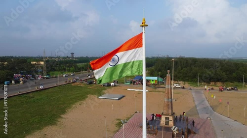 India flag flying high at Connaught Place with pride in blue sky, India flag fluttering, Indian Flag on Independence Day and Republic Day of India, photo