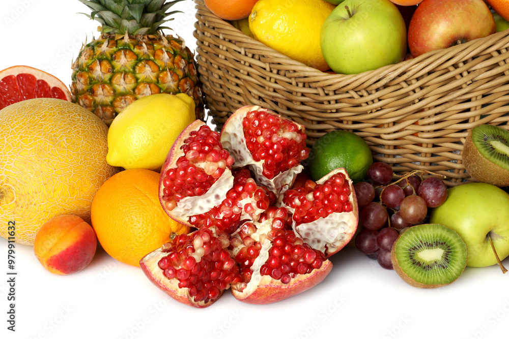 Many different fresh fruits in wicker basket isolated on white Many different fresh fruits in wicker basket isolated on white